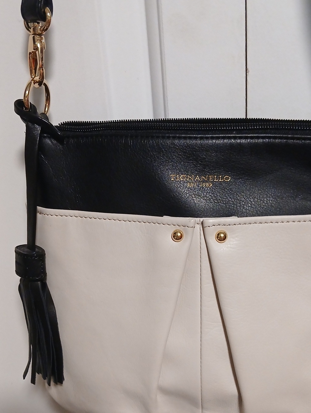 Tignanello Black and Cream Two-Tone Leather Shoulder Bag with Tassel